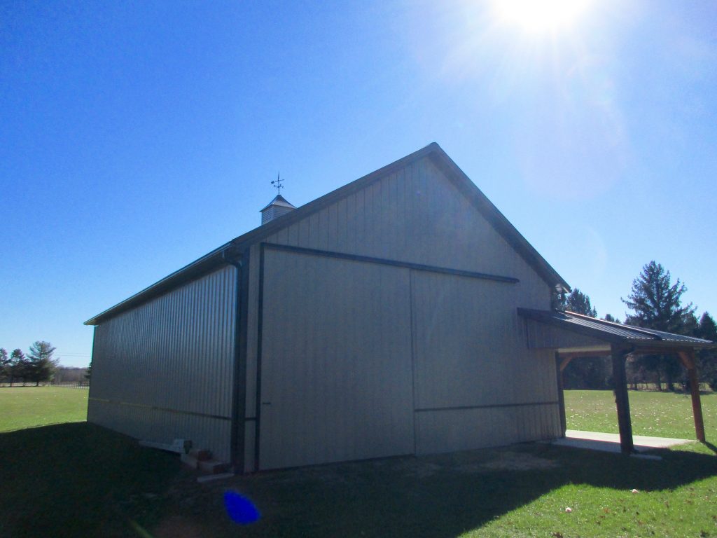 Chuck, Osceola, IN - 30x52x13 with a porch in front and a wrap around porch in the back. Burnished Slate roof and Taupe sides.