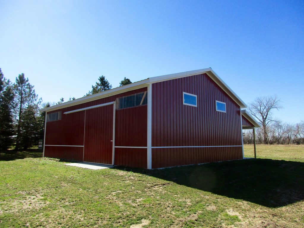 Doug-Buchanan, MI 30x40x12 with 8x40 porch. Hunter Green roof, and Rustic Red sides.